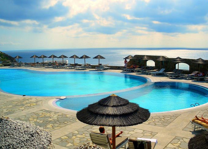 Superb pool and views beyond the spectacular at the Royal Myconian Hotel in Mykonos Superb pool and views beyond the spectacular at the Royal Myconian Hotel in Mykonos